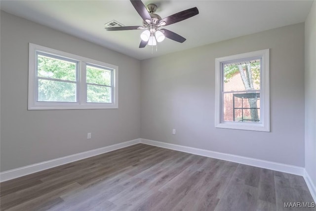 3468 Biltmore Ave, Montgomery, AL 36109 - spare room with healthy amount of natural light, baseboards, and dark wood-style floors
