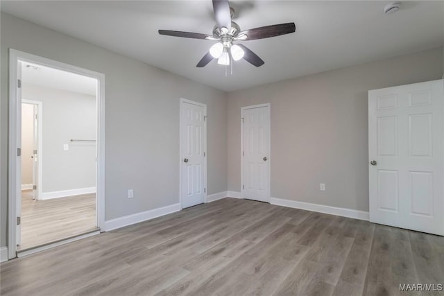 3468 Biltmore Ave, Montgomery, AL 36109 - unfurnished bedroom with wood finished floors, baseboards, and a ceiling fan