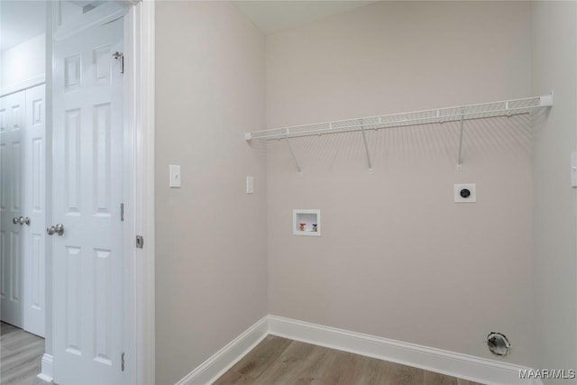 3468 Biltmore Ave, Montgomery, AL 36109 - laundry area featuring hookup for an electric dryer, wood finished floors, hookup for a washing machine, and baseboards