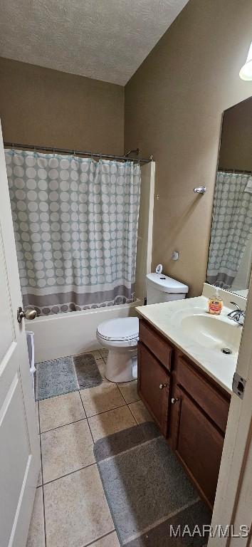 6200 Sycamore Dr, Montgomery, AL 36117 - bathroom featuring vanity, tile patterned flooring, a textured ceiling, and shower / bath combo