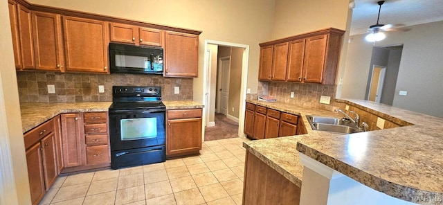 6200 Sycamore Dr, Montgomery, AL 36117 - kitchen with black appliances, light tile patterned floors, ceiling fan, tasteful backsplash, and brown cabinets