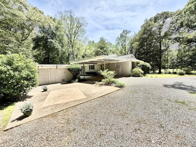 441 County Road 401, Selma, AL 36701 - rear view of house with a patio area, view of scattered trees, and stucco siding
