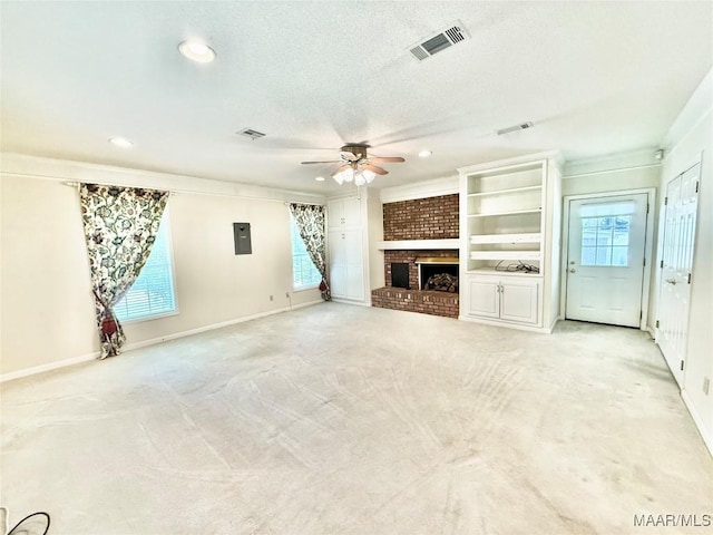 441 County Road 401, Selma, AL 36701 - unfurnished living room with ceiling fan, a brick fireplace, recessed lighting, light colored carpet, and a textured ceiling