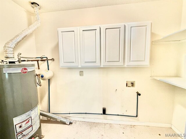 441 County Road 401, Selma, AL 36701 - laundry area with water heater, cabinet space, and washer hookup