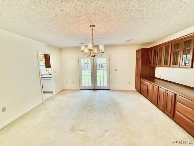 441 County Road 401, Selma, AL 36701 - unfurnished dining area featuring a chandelier, light carpet, french doors, a textured ceiling, and baseboards