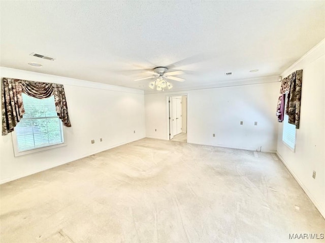 441 County Road 401, Selma, AL 36701 - spare room with plenty of natural light, a ceiling fan, light colored carpet, and crown molding