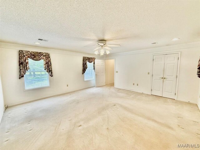 441 County Road 401, Selma, AL 36701 - empty room featuring a ceiling fan, light carpet, a textured ceiling, and baseboards