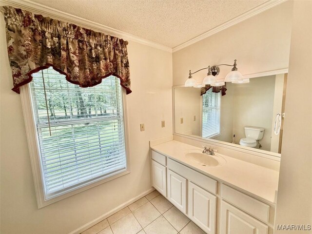 441 County Road 401, Selma, AL 36701 - bathroom with a textured ceiling, tile patterned flooring, toilet, vanity, and baseboards