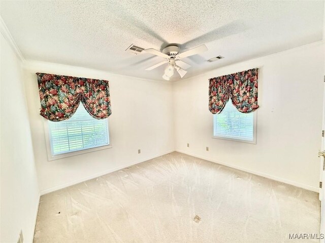 441 County Road 401, Selma, AL 36701 - unfurnished room featuring plenty of natural light, ceiling fan, carpet, a textured ceiling, and ornamental molding