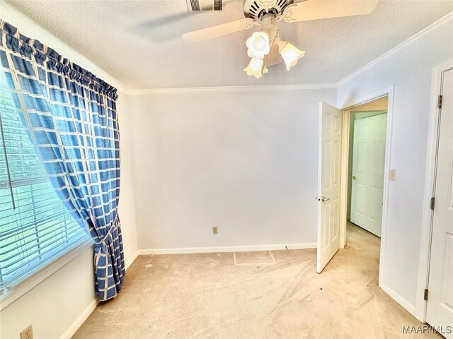 441 County Road 401, Selma, AL 36701 - empty room featuring a textured ceiling, carpet floors, ornamental molding, baseboards, and ceiling fan