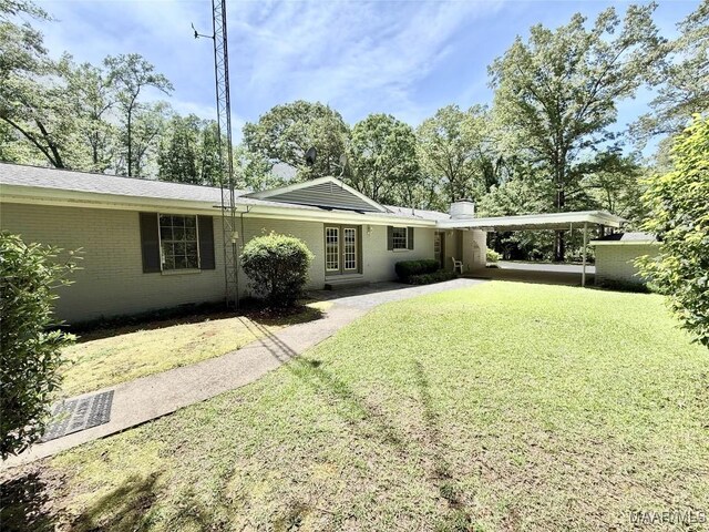 441 County Road 401, Selma, AL 36701 - rear view of house featuring a yard, a chimney, and brick siding
