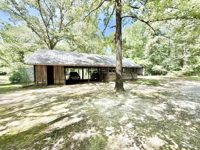 441 County Road 401, Selma, AL 36701 - view of front of home with an outdoor structure, a carport, and a pole building