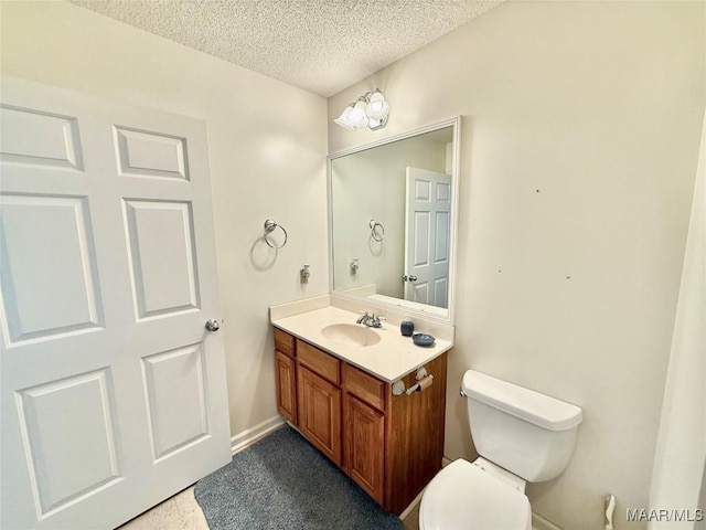 441 County Road 401, Selma, AL 36701 - bathroom with a textured ceiling, toilet, vanity, and baseboards