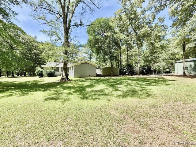 441 County Road 401, Selma, AL 36701 - view of green lawn with view of wooded area and an outdoor structure
