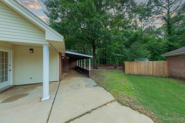 929 Ironwood Dr, Montgomery, AL 36117 - view of yard with an attached carport, driveway, and a patio area