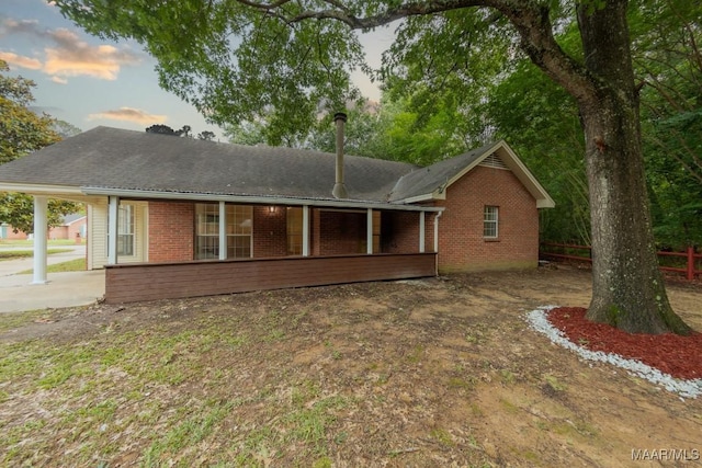 929 Ironwood Dr, Montgomery, AL 36117 - rear view of property with brick siding, a porch, and roof with shingles