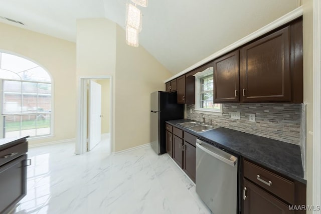 929 Ironwood Dr, Montgomery, AL 36117 - kitchen with stainless steel appliances, dark countertops, a sink, dark brown cabinets, and backsplash
