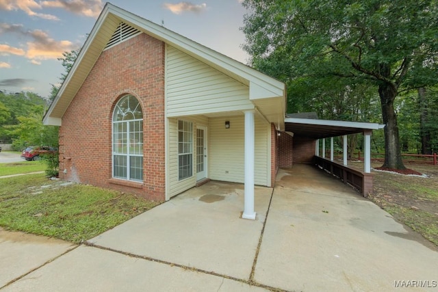 929 Ironwood Dr, Montgomery, AL 36117 - view of front facade featuring brick siding and an attached carport