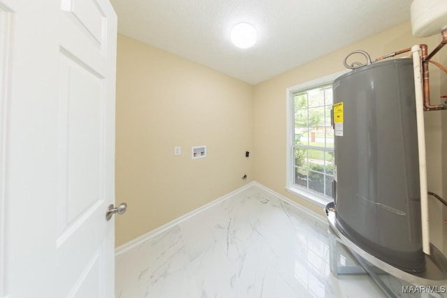929 Ironwood Dr, Montgomery, AL 36117 - laundry room with water heater, baseboards, marble finish flooring, electric dryer hookup, and a textured ceiling