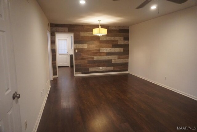 1324-1326 Federal Dr, Montgomery, AL 36107 - unfurnished dining area featuring wooden walls, dark wood finished floors, baseboards, a ceiling fan, and recessed lighting