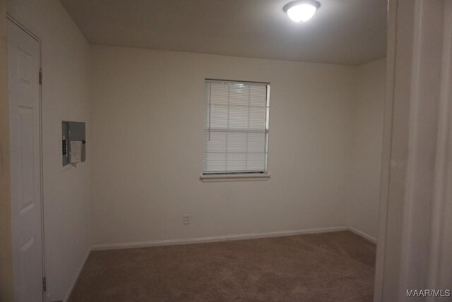 1324-1326 Federal Dr, Montgomery, AL 36107 - unfurnished room with carpet, baseboards, and electric panel