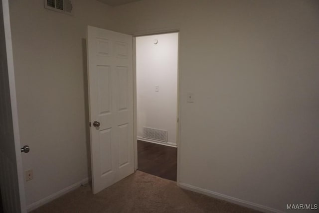 1324-1326 Federal Dr, Montgomery, AL 36107 - unfurnished room featuring baseboards and carpet