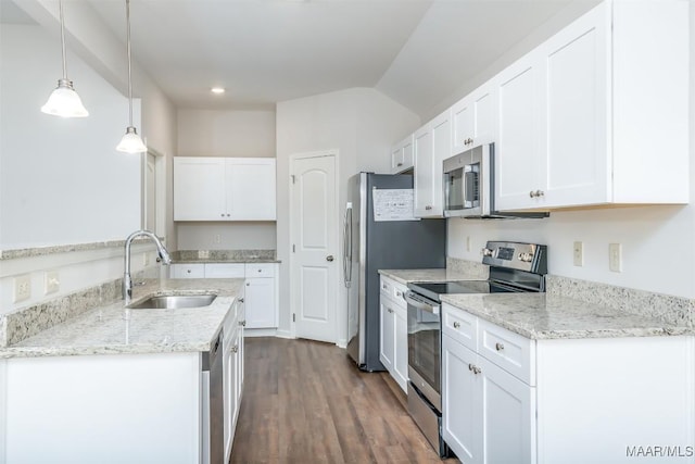 2043 Dawsons Mill Loop, Prattville, AL 36067 - kitchen with stainless steel appliances, a sink, white cabinetry, pendant lighting, and lofted ceiling