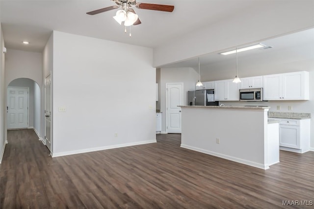 2043 Dawsons Mill Loop, Prattville, AL 36067 - kitchen with appliances with stainless steel finishes, dark wood-style flooring, and arched walkways