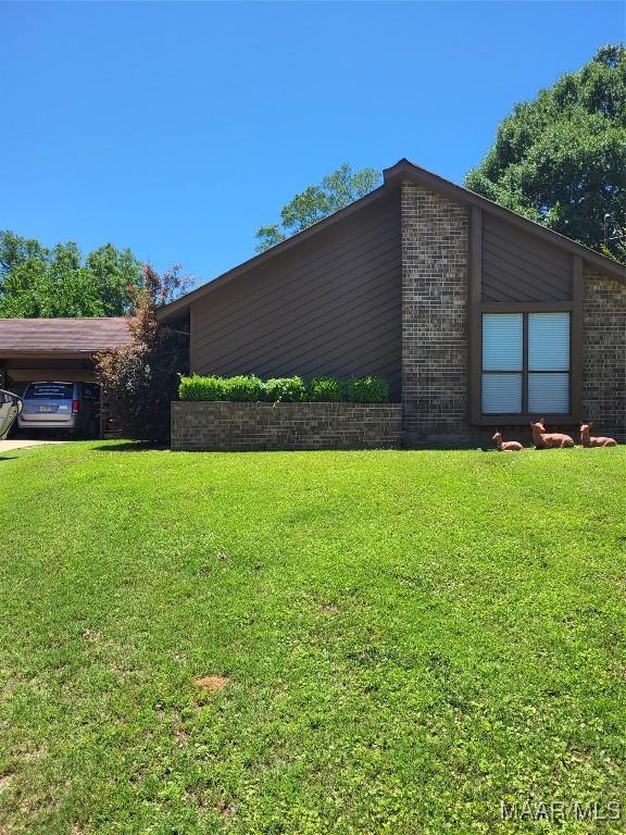 480 Avon Rd, Montgomery, AL 36109 - view of property exterior featuring brick siding and a yard