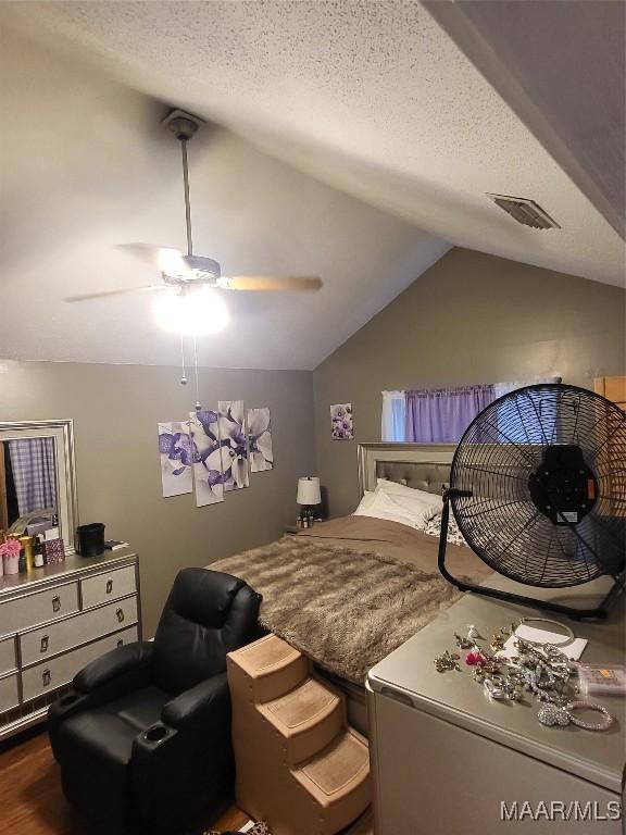 480 Avon Rd, Montgomery, AL 36109 - bedroom with vaulted ceiling, a ceiling fan, wood finished floors, and a textured ceiling
