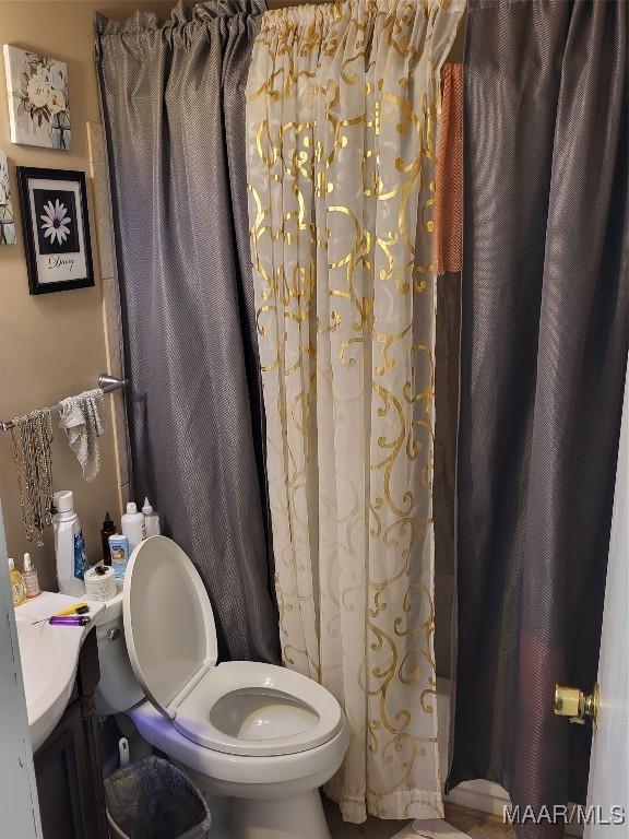 480 Avon Rd, Montgomery, AL 36109 - full bath with toilet, shower / bathtub combination with curtain, and vanity