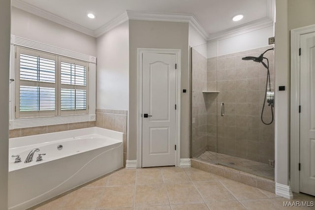 541 Jasmine Trl, Prattville, AL 36066 - bathroom with a stall shower, a bath, tile patterned flooring, baseboards, and crown molding