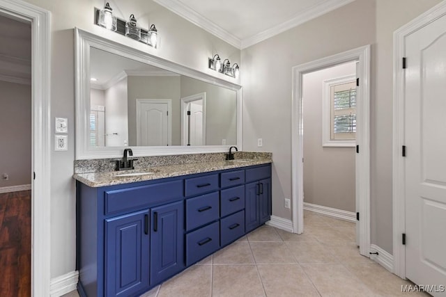 541 Jasmine Trl, Prattville, AL 36066 - full bathroom with double vanity, ornamental molding, baseboards, and tile patterned flooring