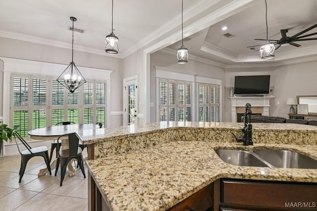 541 Jasmine Trl, Prattville, AL 36066 - kitchen featuring a sink, ceiling fan, pendant lighting, a chandelier, and ornamental molding