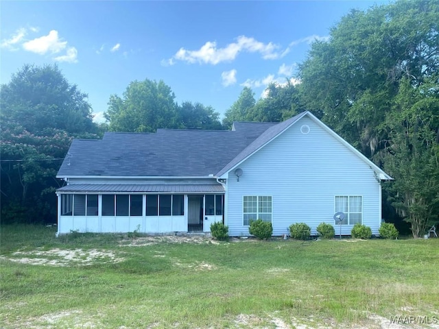 4564 Hickory Grove Rd W, Letohatchee, AL 36047 - view of front of home with a sunroom, a front lawn, and roof with shingles