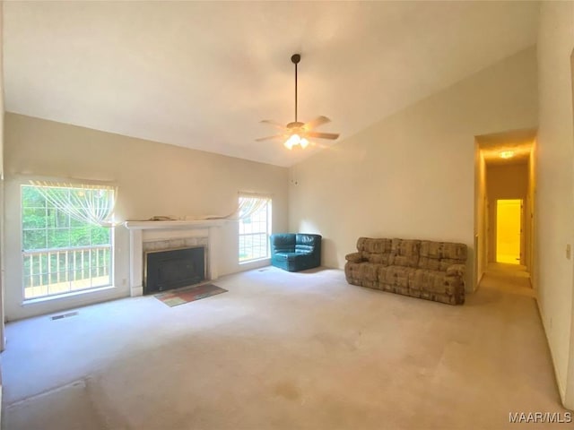 4564 Hickory Grove Rd W, Letohatchee, AL 36047 - living room with carpet, vaulted ceiling, a fireplace with flush hearth, and ceiling fan