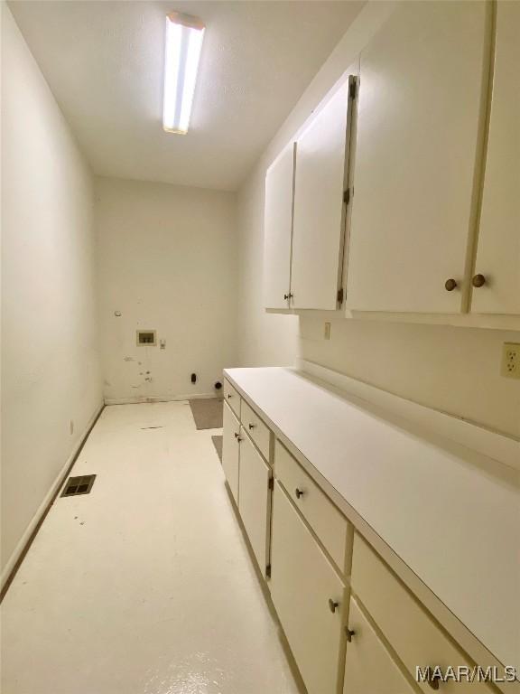 4564 Hickory Grove Rd W, Letohatchee, AL 36047 - laundry room featuring cabinet space and washer hookup