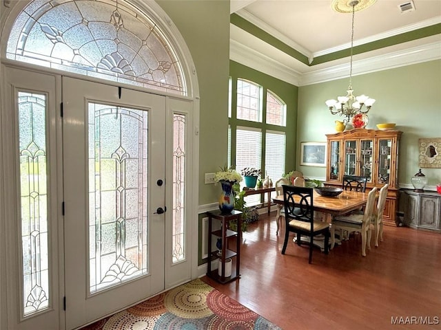 40 Larkspur Ln, Millbrook, AL 36054 - foyer entrance with a chandelier, wood finished floors, ornamental molding, a high ceiling, and a tray ceiling