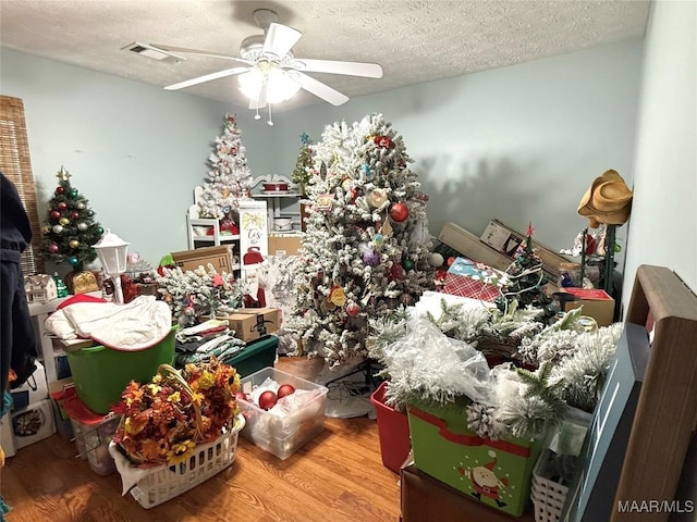 40 Larkspur Ln, Millbrook, AL 36054 - miscellaneous room with a ceiling fan, wood finished floors, and a textured ceiling