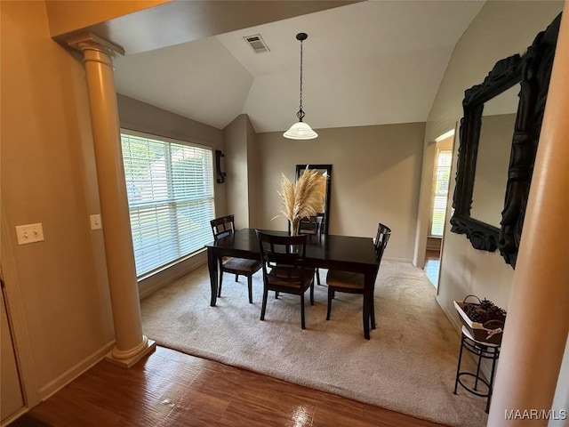 3701 Claiborne Cir, Montgomery, AL 36116 - dining space with ornate columns, lofted ceiling, baseboards, and wood finished floors