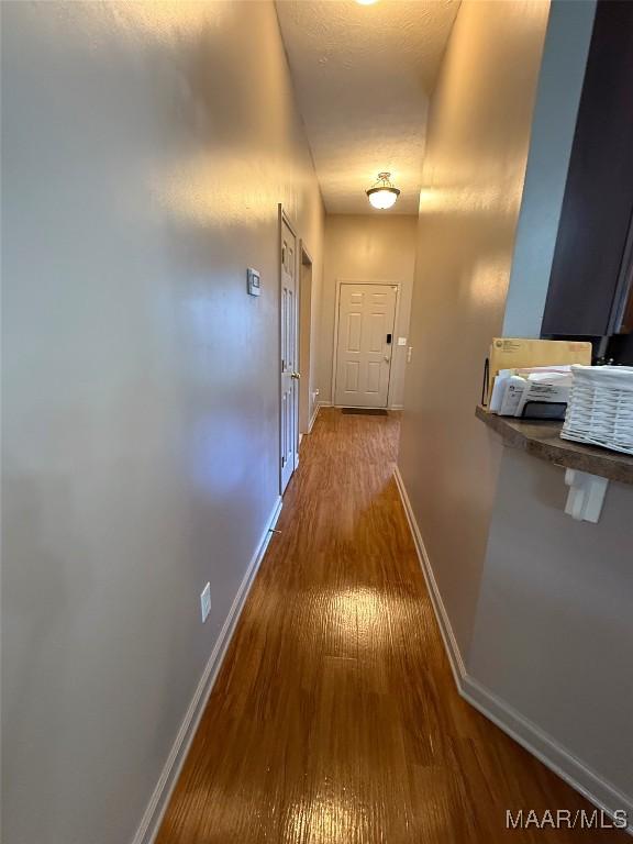 3701 Claiborne Cir, Montgomery, AL 36116 - corridor with wood finished floors and baseboards