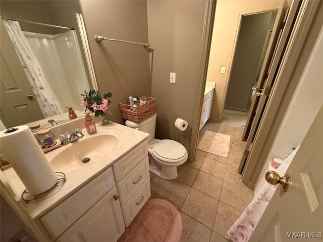 3701 Claiborne Cir, Montgomery, AL 36116 - full bathroom with vanity, toilet, tile patterned floors, and a shower with shower curtain