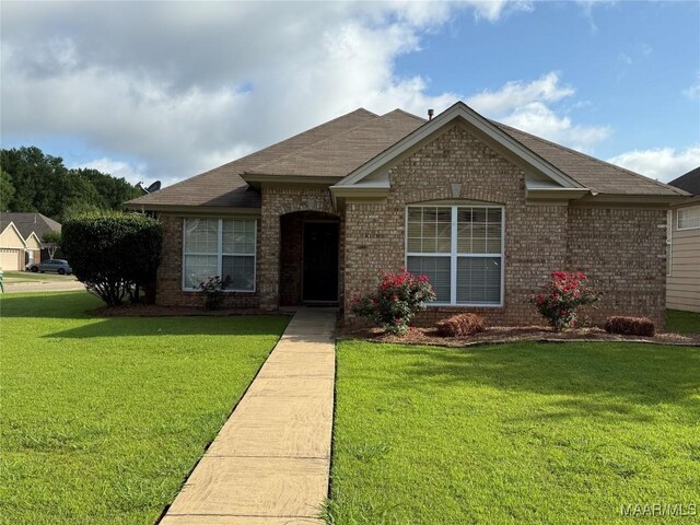 3701 Claiborne Cir, Montgomery, AL 36116 - view of front facade with brick siding, a front yard, and roof with shingles