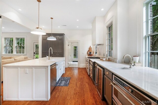 3328 Lebron Rd, Montgomery, AL 36106 - kitchen with a sink, light wood finished floors, wine cooler, stainless steel appliances, and recessed lighting