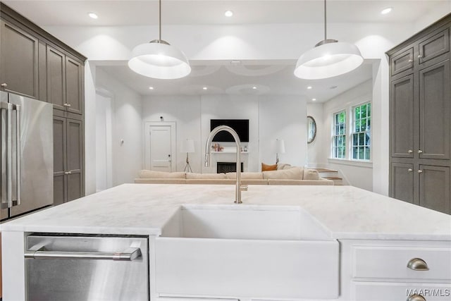 3328 Lebron Rd, Montgomery, AL 36106 - kitchen with a sink, open floor plan, stainless steel appliances, pendant lighting, and recessed lighting