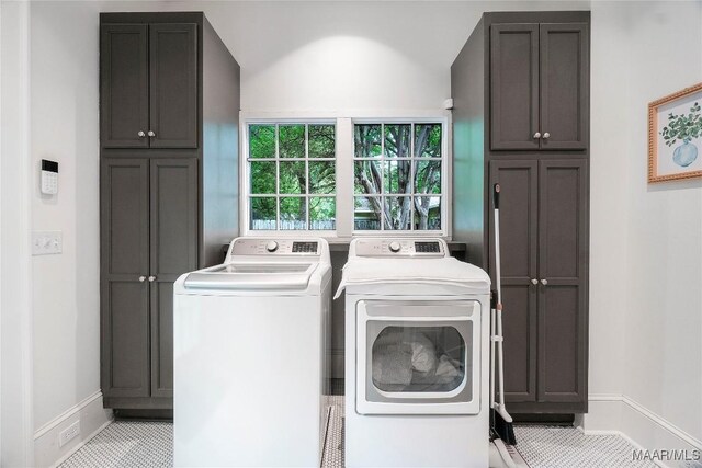 3328 Lebron Rd, Montgomery, AL 36106 - laundry room with cabinet space, washer and clothes dryer, and baseboards