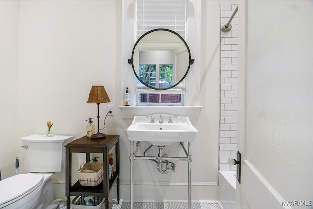 3328 Lebron Rd, Montgomery, AL 36106 - bathroom featuring toilet,  shower combination, baseboards, and a sink
