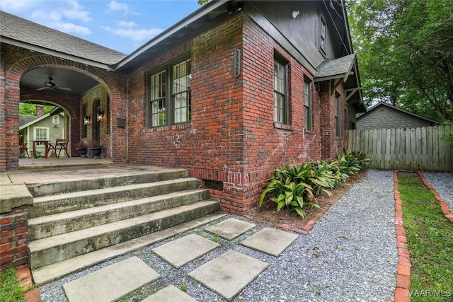 3328 Lebron Rd, Montgomery, AL 36106 - entrance to property featuring a ceiling fan, brick siding, and covered porch