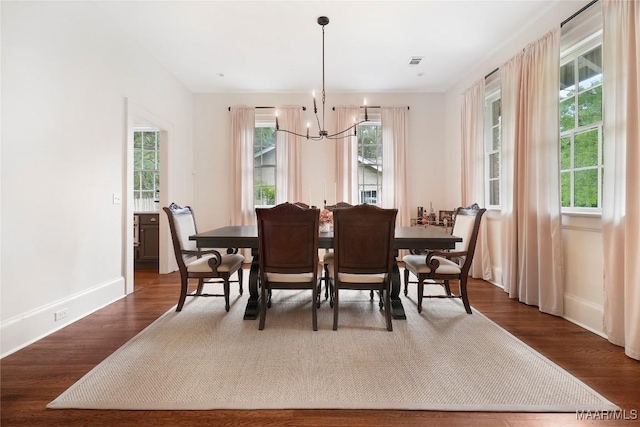 3328 Lebron Rd, Montgomery, AL 36106 - dining space with a chandelier, plenty of natural light, and dark wood finished floors