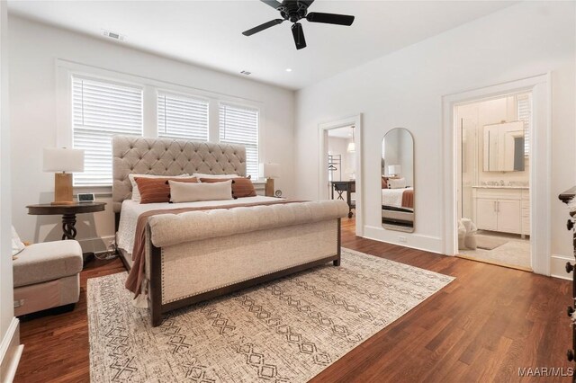 3328 Lebron Rd, Montgomery, AL 36106 - bedroom featuring dark wood-style floors, ensuite bathroom, and baseboards
